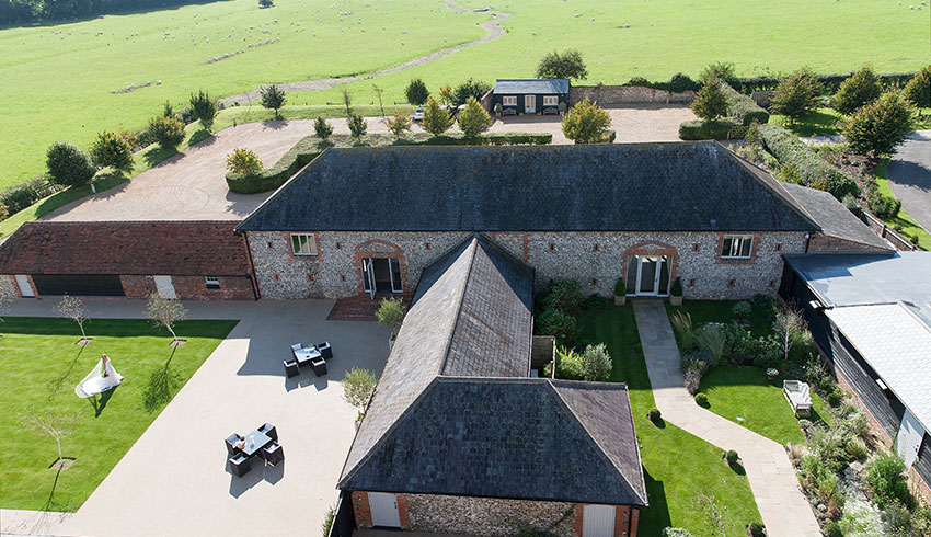 An aerial view of Farbridge wedding barn in West Sussex