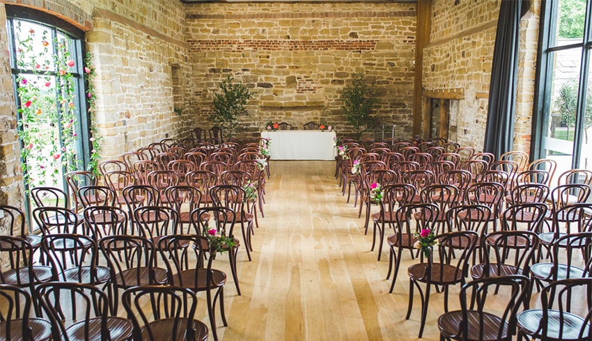 A stunning wedding ceremony set up at Hendall Manor Barn, East Sussex wedding venue