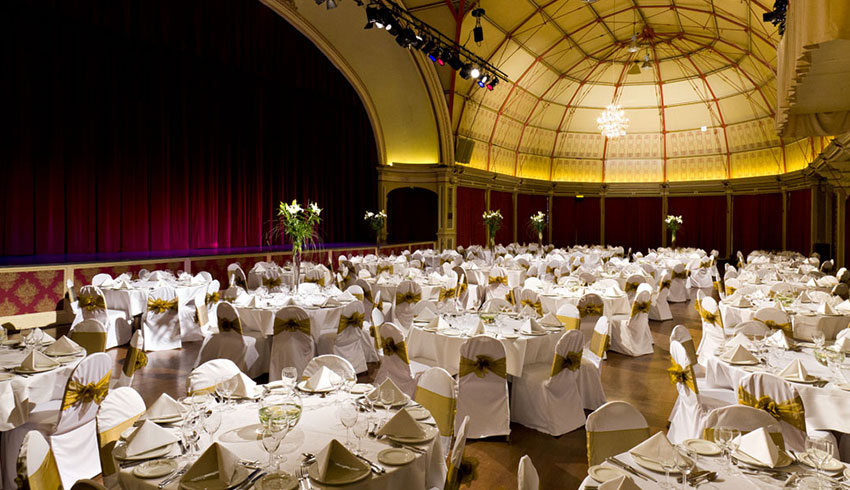 The Winter Gardens in Eastbourne set up for a wedding with its impressive historic interior